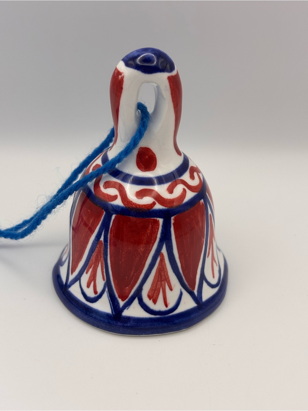 Hand-Painted Ceramic Hanging Bell Featuring Red and Blue Glazed Patterns
